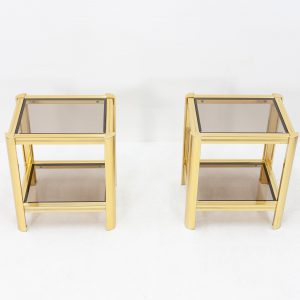 Two small brass side tables