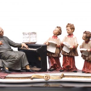 A large Capodimonte porcelain figure group Schola Cantorum, ”The Choirboys”